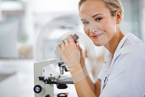 Happy woman, portrait and laboratory with forensic microscope for research, scientific test or discovery. Female person