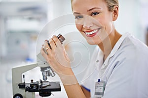 Happy woman, portrait and microscope with exam for laboratory research, scientific test or discovery. Face of female