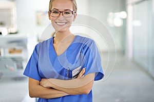 Happy woman, portrait and professional nurse with arms crossed at laboratory for healthcare or science. Young female