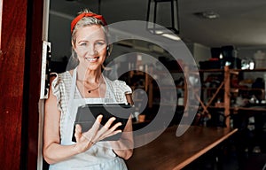 Happy woman, portrait smile and tablet in small business confidence at entrance for workshop in retail store. Confident