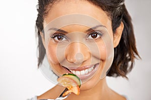Happy woman, portrait and vegetable salad for diet, snack or natural nutrition against a studio background. Closeup of