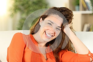 Happy woman posing looking at camera at home