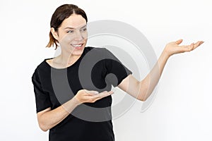 Happy woman presenting product against white background