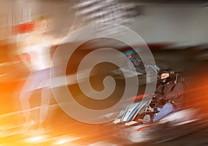 Happy woman with race flag and man driving car