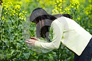 Happy woman in rapeseed field