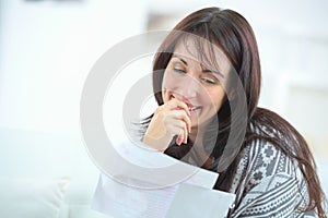 Happy woman reading letter