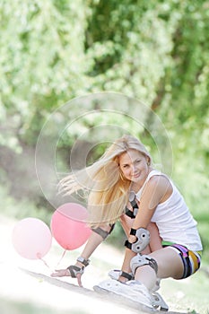 Happy woman ready for roller skating / blading photo