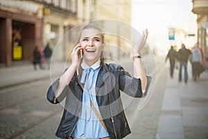 Happy woman receiving good news on the phone