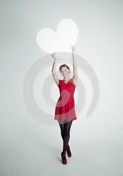 Happy Woman in Red Dress Holding White Blank Heart Banner