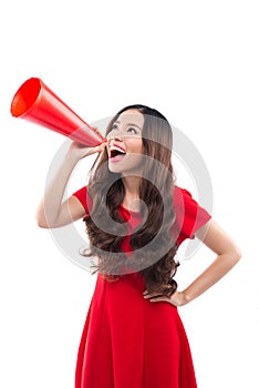 Happy woman with red dress and yell with megaphone