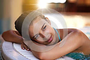 Happy woman, relax and water with jacuzzi at spa for holiday, getaway or stress relief at hotel or resort. Face of calm