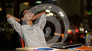 Happy woman relaxing on chair, satisfied with productive working day, freelance