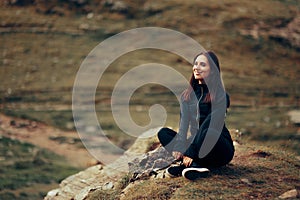 Happy Woman Relaxing Outdoors after Training Taking a Break and Admiring Natire photo