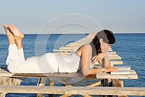 Happy woman relaxing reading