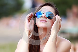 Happy woman relaxing in the sun