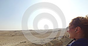 Happy woman riding horse at Giza pyramids