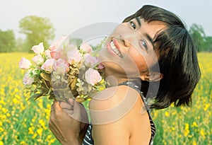 Happy woman rose flower field.