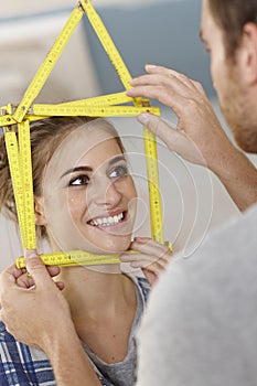 Happy woman with ruler