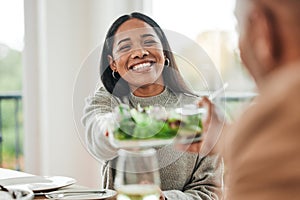 Happy woman, salad and family dinner at thanksgiving celebration at home. Food, female person and eating at a table with