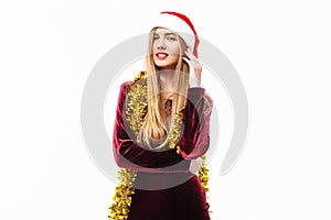 Happy woman in santa hat and dress, celebrating new year, with t