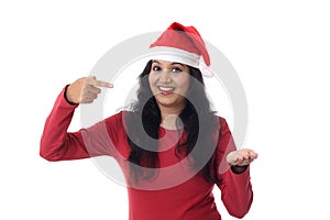 Happy woman in Santa hat with empty copy space