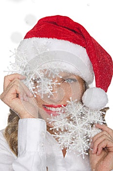 Happy woman in Santa hat with snowflakes