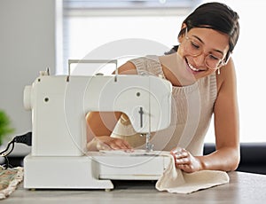 Happy, woman and sewing machine in apartment for small business, fashion design and pride. Female seamstress, smile and