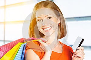 Happy woman on shopping with bags and credit cards, christmas sa