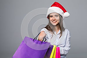 Happy woman with shopping bags. Sales. christmas gifts. Christmas shopping girl on ghite background. Christmas gift.