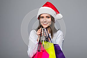 Happy woman with shopping bags. Sales. christmas gifts. Christmas shopping girl isolated on ghite background. Christmas gift.