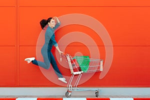 Happy Woman with Shopping Jumping with Joy