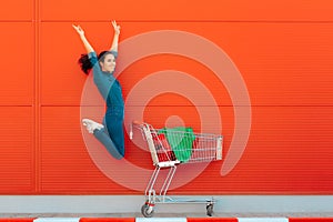 Happy Woman with Shopping Jumping with Joy