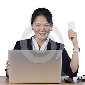 Happy woman shopping online paying with credit card.