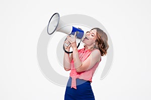 Happy woman shouting in megaphone