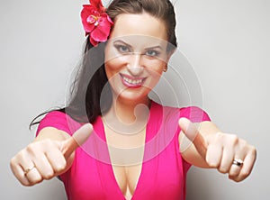 Happy woman showing thumbs up