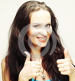 Happy woman showing thumbs up