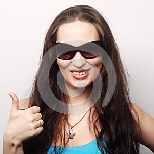 Happy woman showing thumbs up