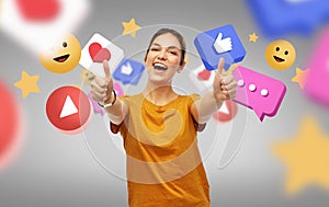 happy woman showing thumbs up over internet icons