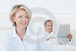 Happy woman sitting in front of man