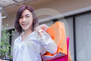 Happy woman smile and holding shpping bags shopping on the day