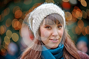 Happy woman smiling and Christmas tree behind