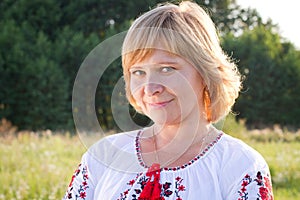 Happy woman smiling in the nature background.