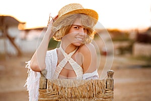 Happy woman smiling and wearing beach hat having summer fun during holidays vacation, outdoor
