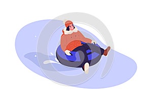 Happy woman on snow tubing sliding down slope. Person having fun on winter holidays. Female enjoying outdoor leisure