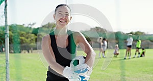 Happy woman, soccer and goal keeper with ball for defense in team sport on green grass field. Portrait of female person