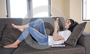 Happy woman on the sofa at home