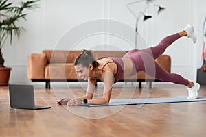 Happy Woman In Sportswear Doing Donkey Kicks Exercise