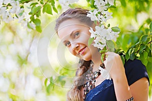 Happy woman in a spring garden