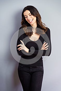 Happy woman standing at isolated background