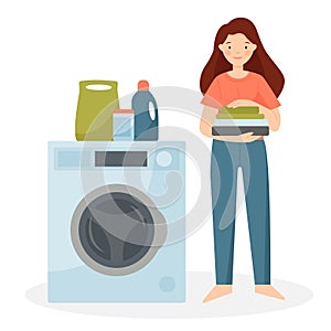 Happy woman stands in the laundry room with clean linen. Bathroom interior. Washing machine with washing powder and